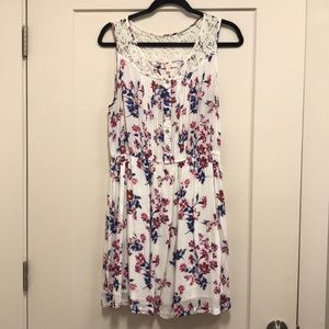 White floral dress with lace trim.